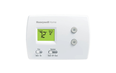 A white Honeywell Home digital thermostat, commonly found in West Chester University housing, displays an indoor temperature and set temperature of 72°F, with up/down arrows and switches for fan and system modes.