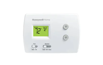 A white Honeywell Home digital thermostat, commonly found in West Chester University housing, displays an indoor temperature and set temperature of 72°F, with up/down arrows and switches for fan and system modes.